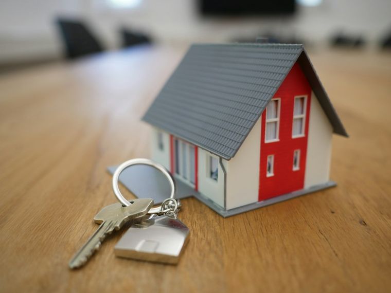 Model house with keys representing a mortgage loan